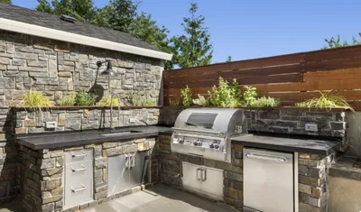 Outdoor kitchen and pool surround built with Turkish natural stone